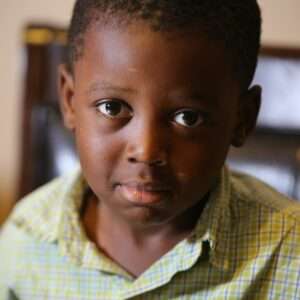 Little boy wearing a green plaid shirt